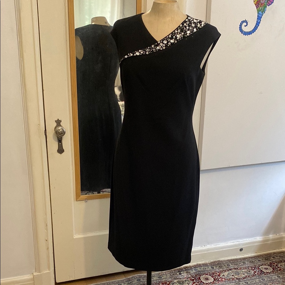 Elegant Black Sleeveless Dress with Floral Embellishments